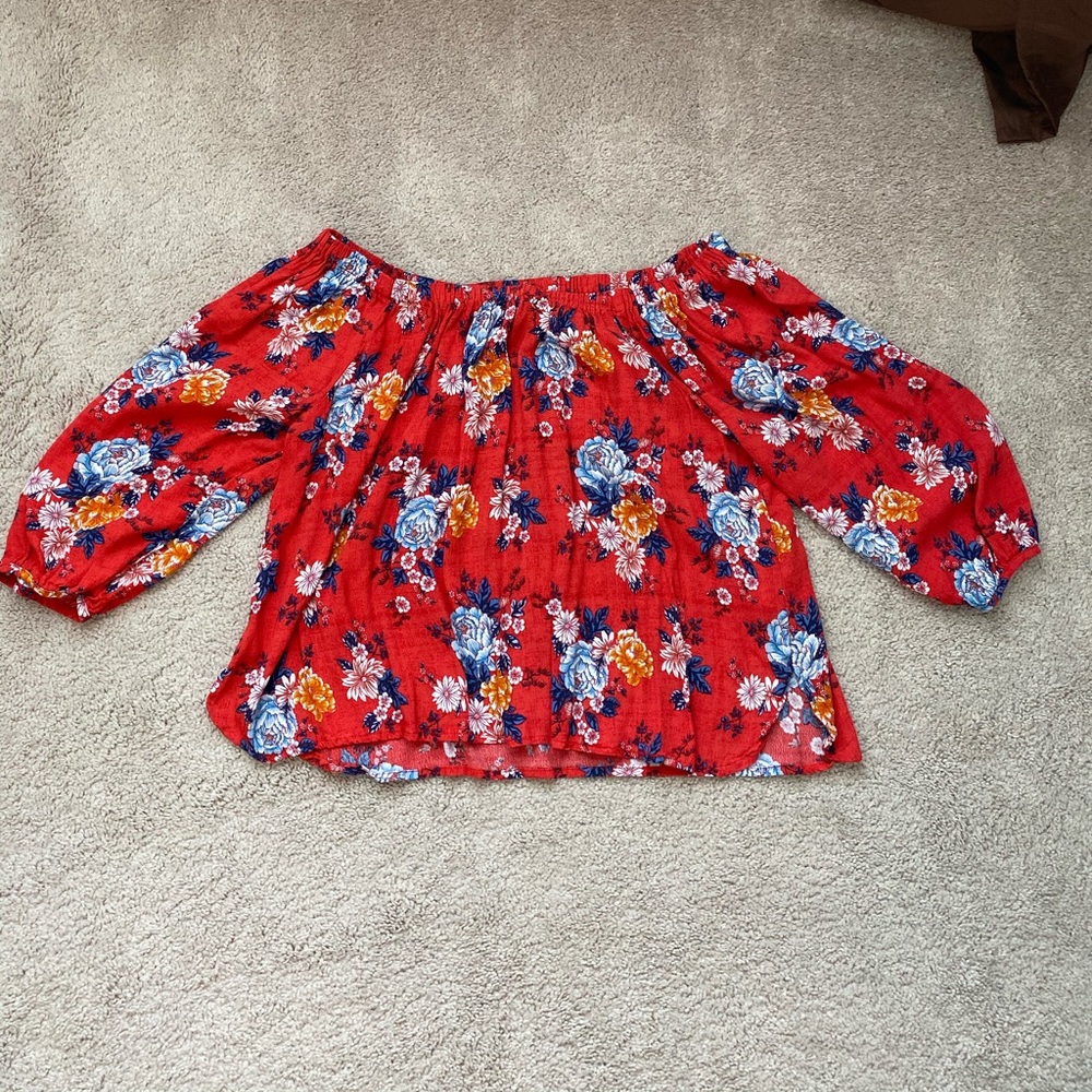 A red off the shoulder top